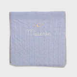 Merino baby blanket with moon and stars design embroidered in soft wool.