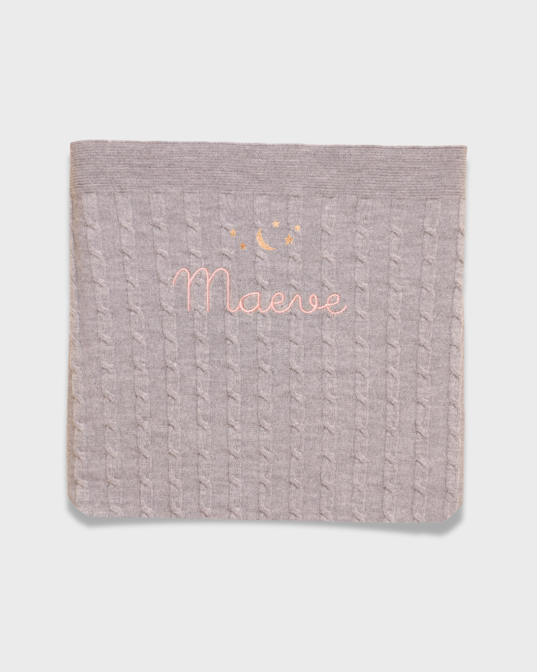 Merino baby blanket with moon and stars embroidery design.