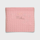 Merino baby blanket with moon and stars design, pink with personalized embroidery.