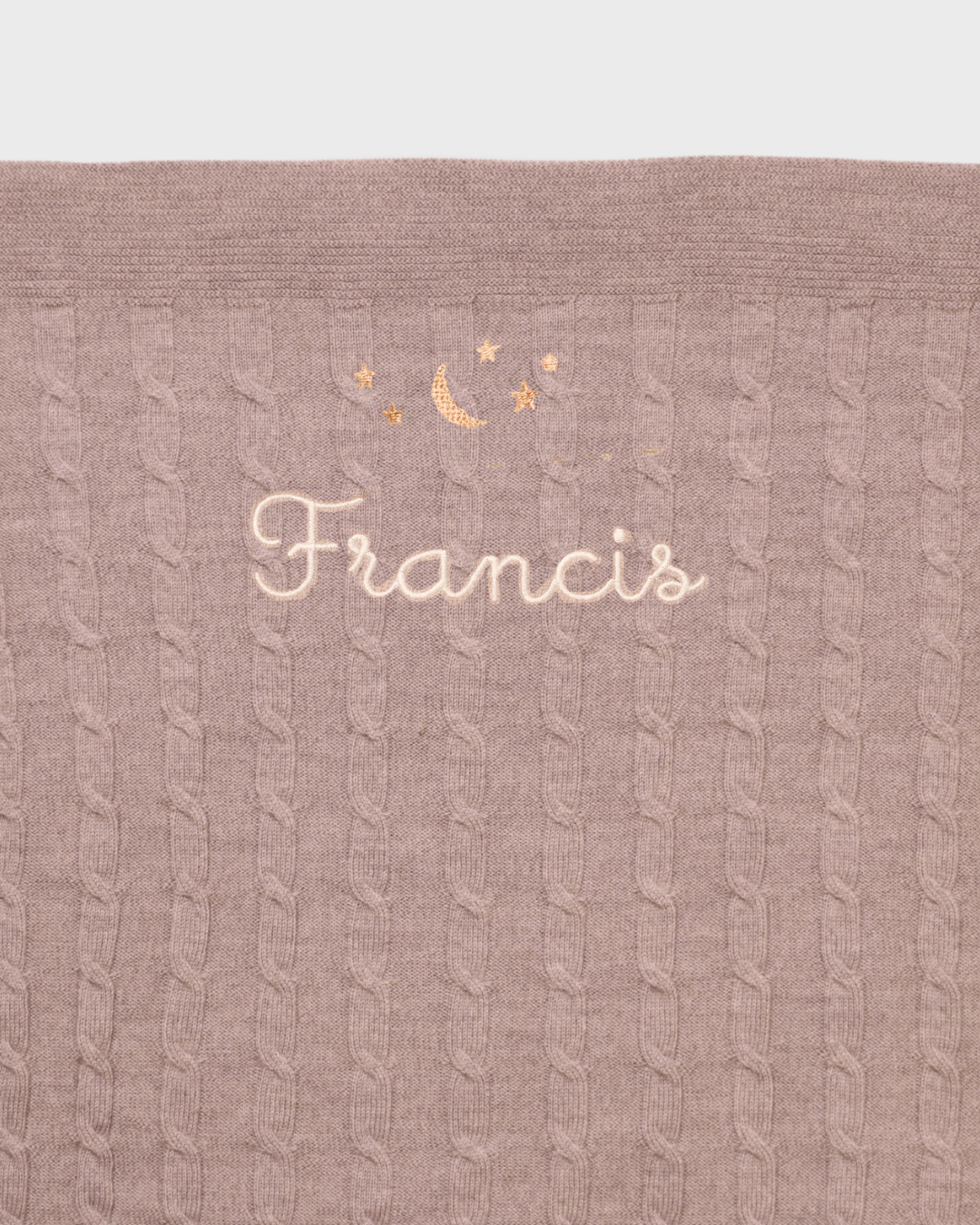 Merino Baby Blanket with moon and stars design and embroidered personalization.