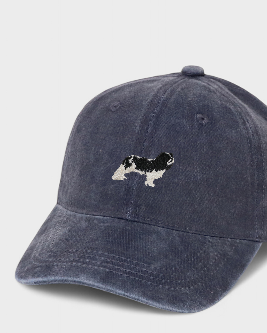 Navy blue King Charles Spaniel personalised baseball hat with hand-embroidered dog design and custom back embroidery option