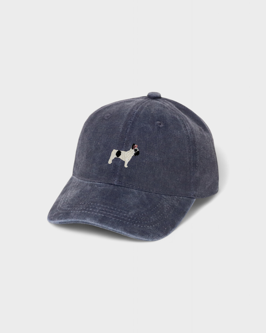 Navy blue baseball cap with embroidered hand-drawn French Bulldog design and personalized back embroidery.