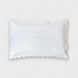 Toddler pillowcase with blush scalloped edge in organic cotton.