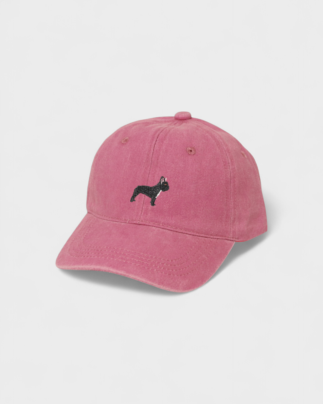 Pink washed cotton baseball hat with embroidered black French Bulldog design on front and option for personalized embroidery on back