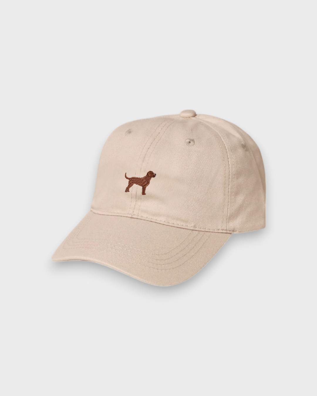 Beige personalised hat with embroidered hand-drawn Labrador design on front, made of 100% washed cotton in classic baseball style