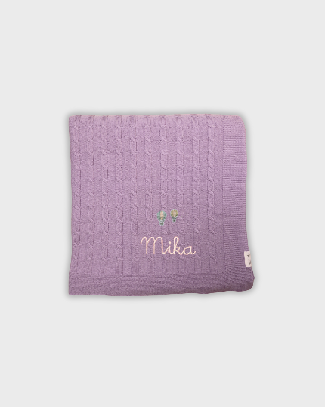 Personalized lavender merino baby blanket with embroidered vintage hot air balloons and name Mika