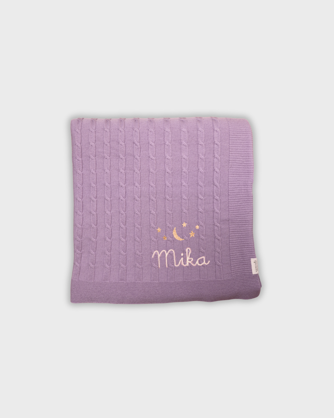 Soft purple Merino baby blanket with embroidered moon, stars, and personalized name "Mika"