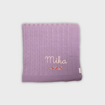 Purple merino baby blanket with rosette cross stitch embroidery and personalized name Mika