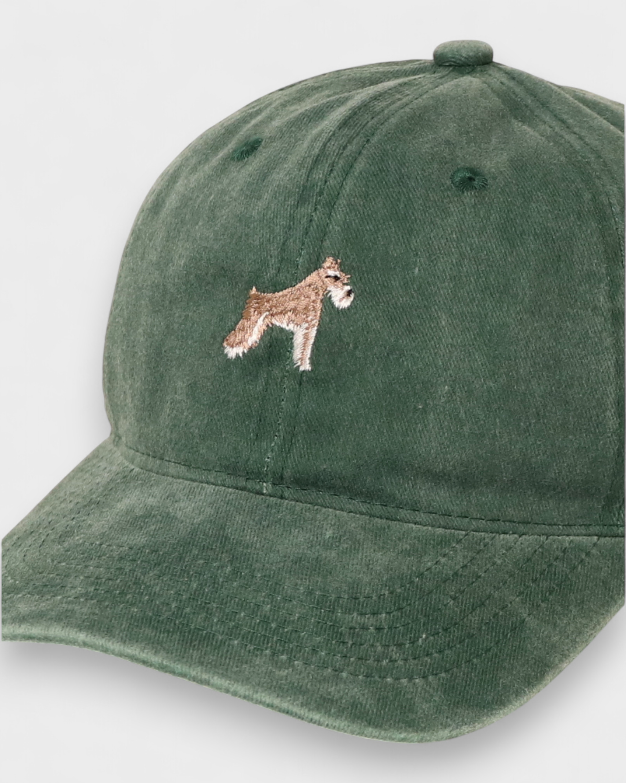 Green Schnauzer personalised hat with embroidered dog design on front, made of 100% washed cotton in classic baseball style.
