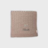 Merino baby blanket with embroidered hot air balloons and personalized name Charlie in soft wool fibers