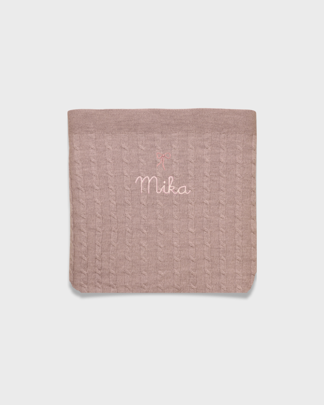 Soft pink merino baby blanket with embroidered name and vintage bow design