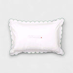Organic cotton toddler pillowcase with sage scalloped edge and embroidered personalization.