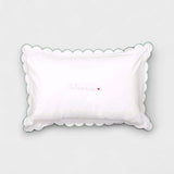 Organic cotton toddler pillowcase with sage scalloped edge and embroidered personalization.
