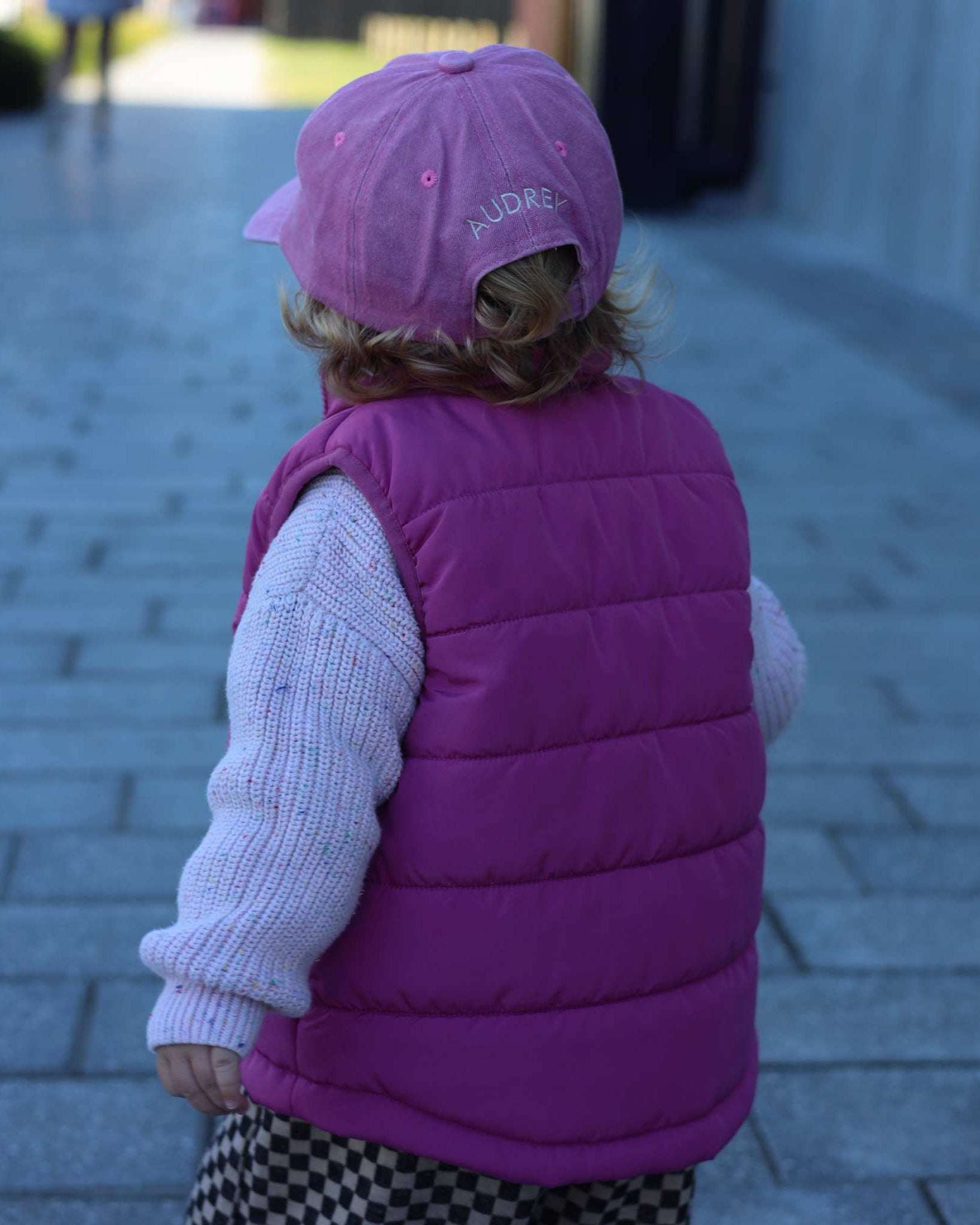 Dalmatian personalised hat worn by child walking on a pathway.