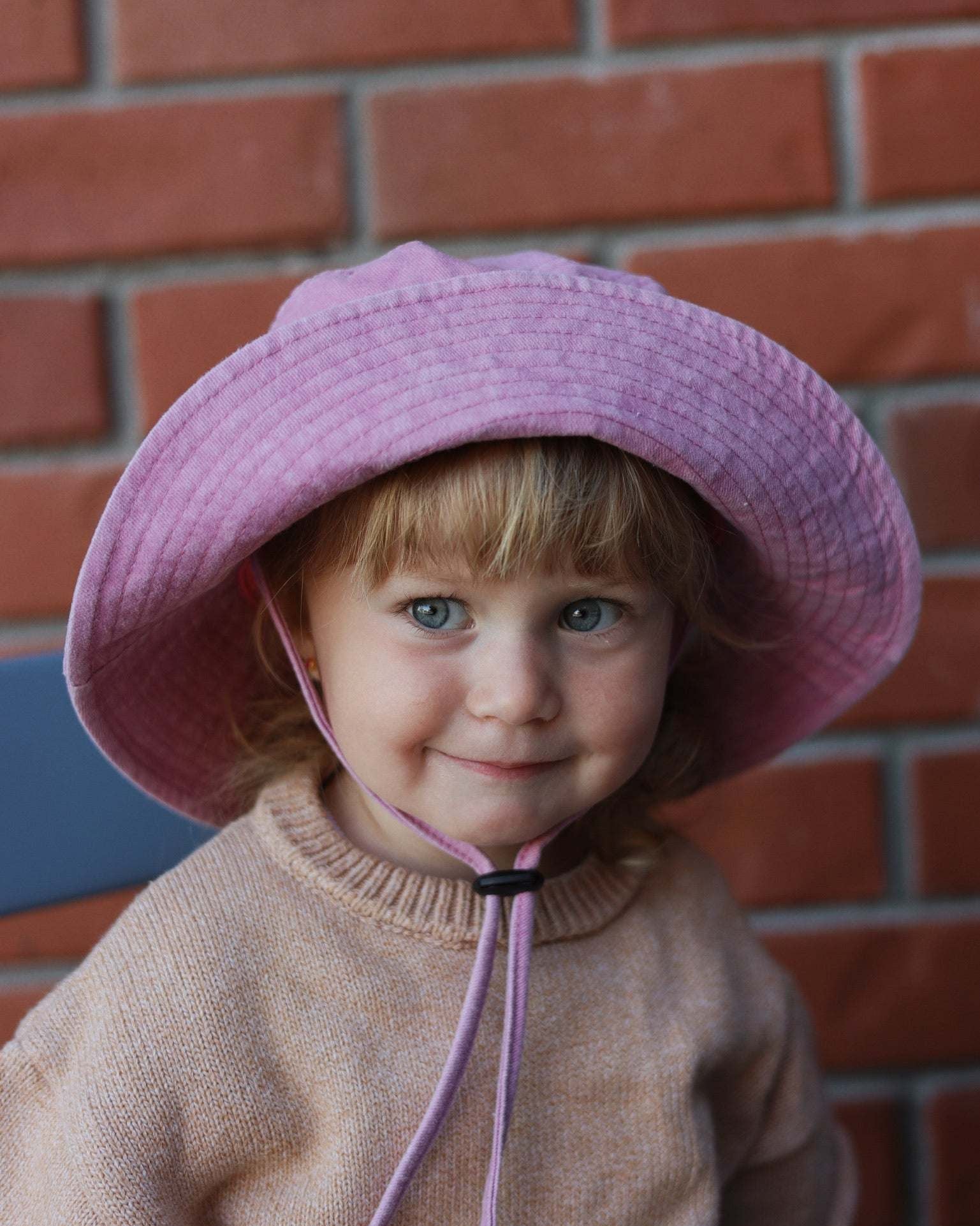 Customised pink bucket hat for kids made of 100% washed cotton.